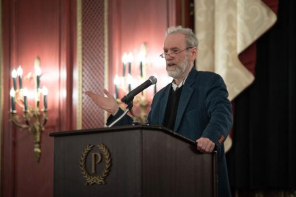 Harry Brighouse giving a talk at a lectern 