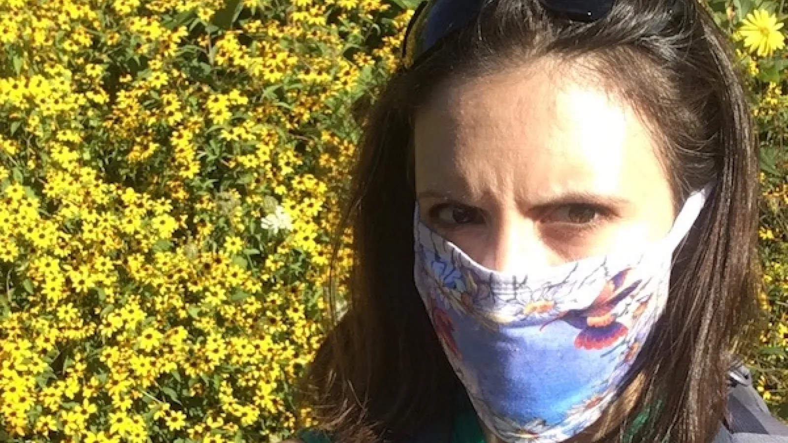Kate in flowers with mask
