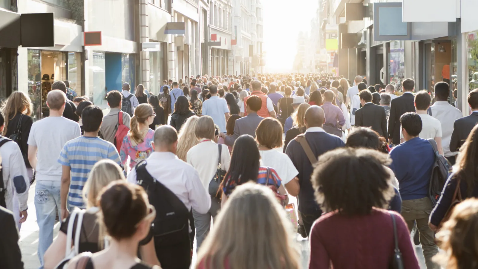 image of individuals on crowded urban street