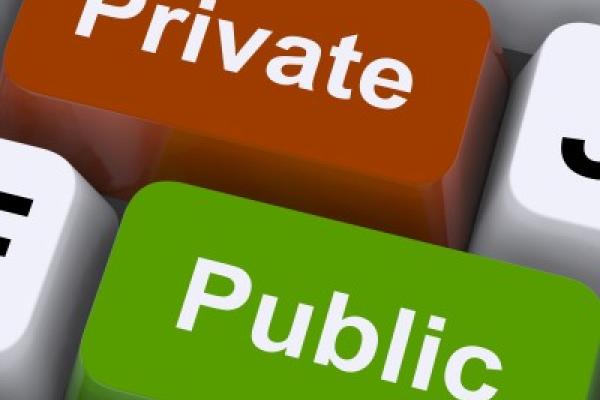a depiction of two keys on a computer keyboard; one says "private," the other says "public"