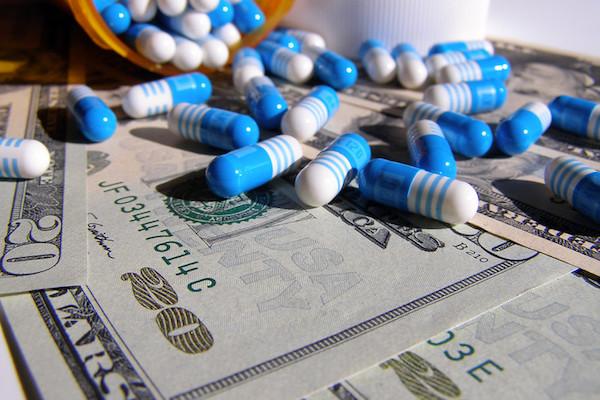Stock photo of pills on bills.