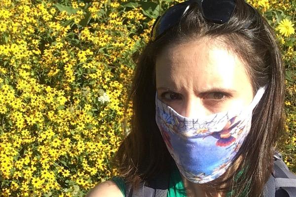 Kate in flowers with mask