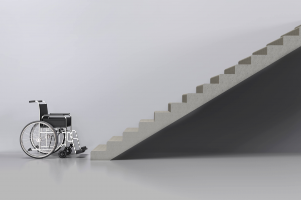 Disability Tech Graphic Wheelchair against white background in front of set of stairs